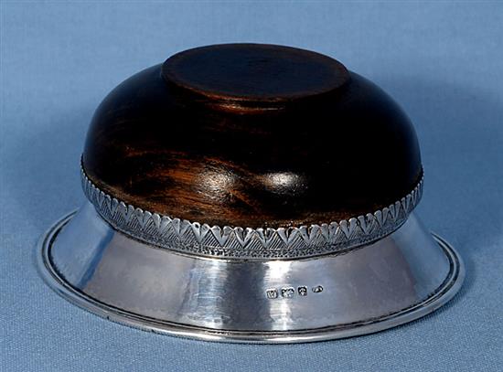 A George V Arts & Crafts planished silver mounted oak mazer, by Albert Edward Jones, Diameter 142mm height 2 ¾”/67mm